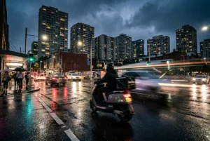 Delivery rider on scooter in vibrant Sydney nightlife scene